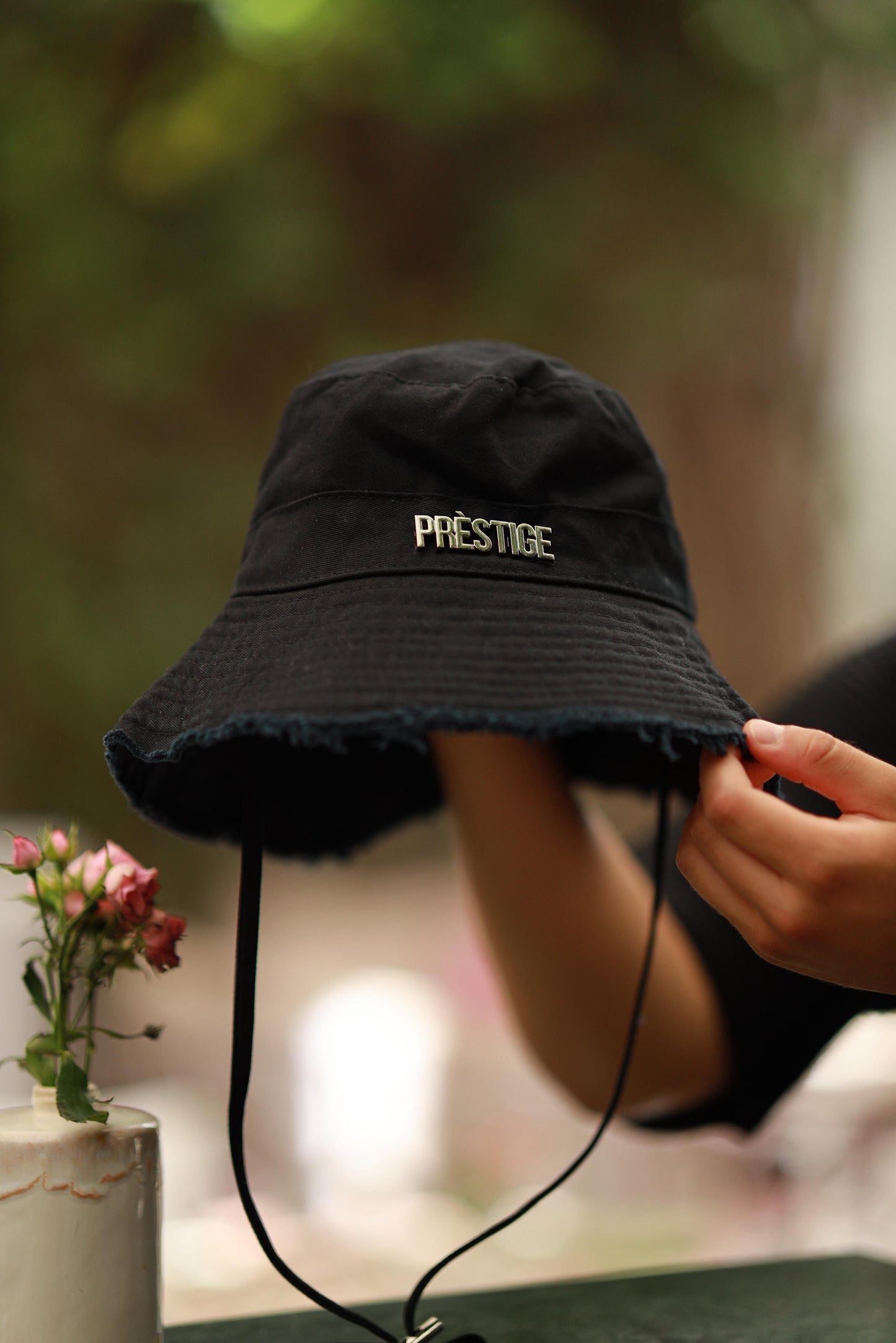 DISTRESSED BLACK BUCKET HAT