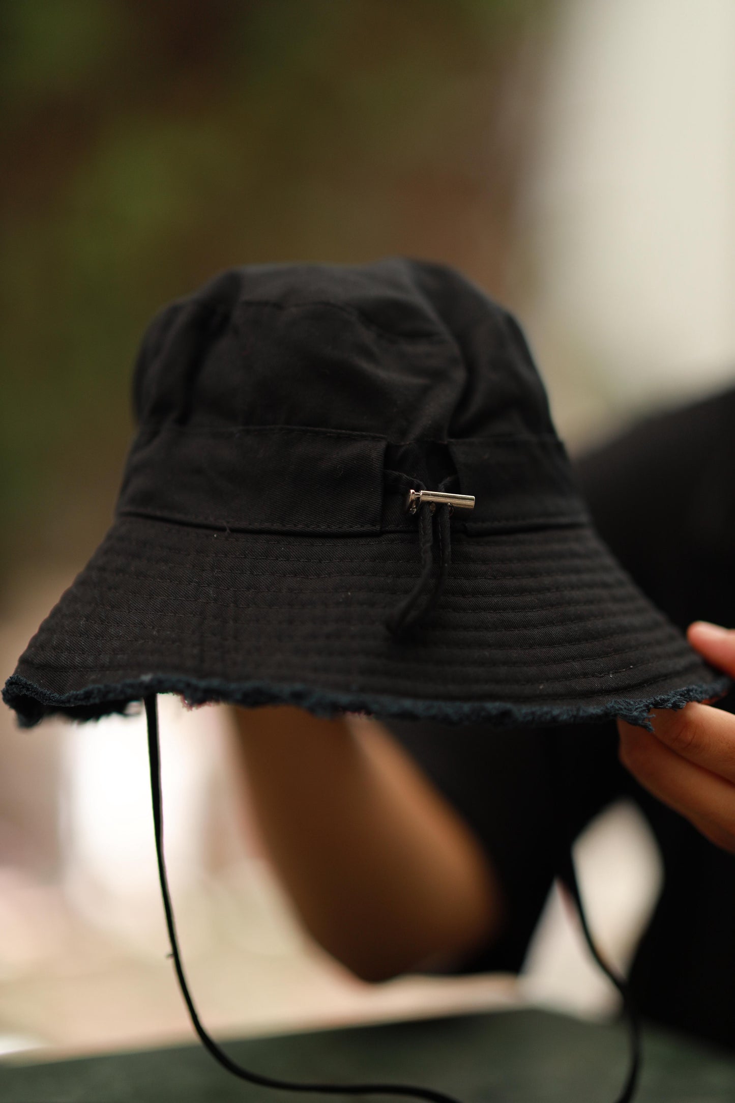 DISTRESSED BLACK BUCKET HAT